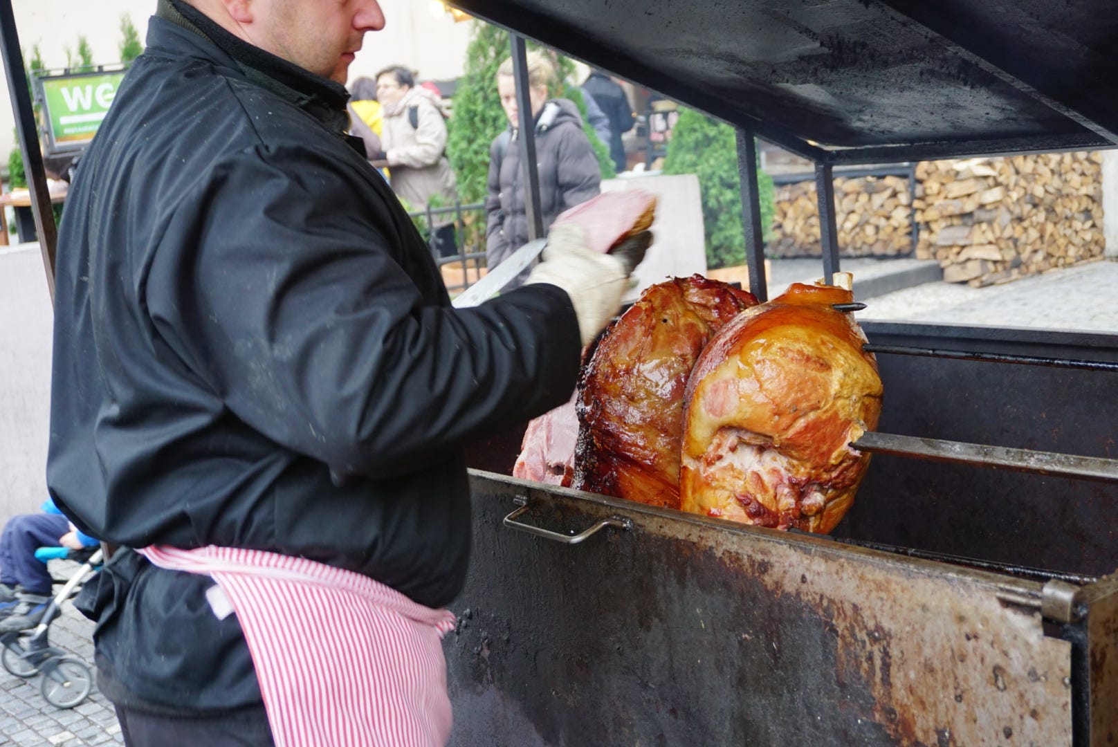 The famous Prague ham roasting on a barbeque spit